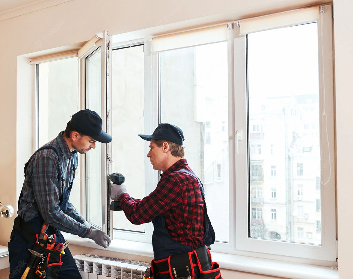 construction-workers-installing-new-window-house2